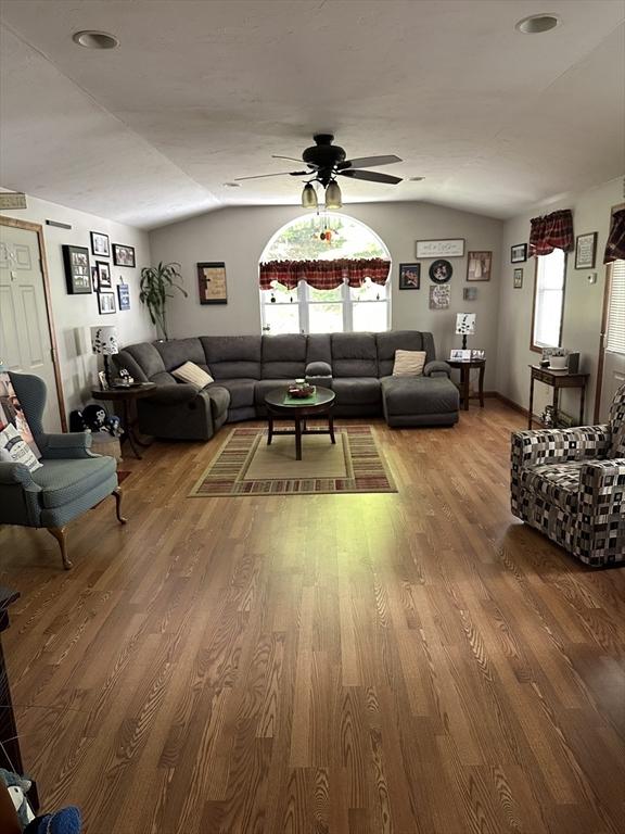 37 Teaberry Ln, Gardner, MA 01440 - living room featuring vaulted ceiling, wood finished floors, and ceiling fan