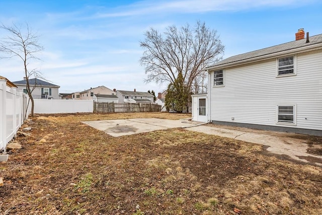 view of yard with a patio and a fenced backyard