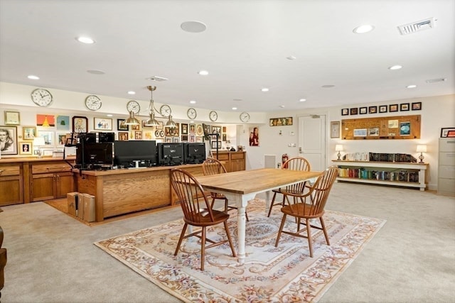 dining room featuring light colored carpet