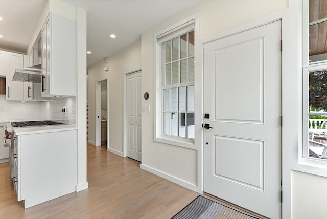 entrance foyer with light wood-type flooring, recessed lighting, and baseboards