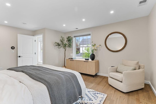 bedroom featuring light wood-type flooring, baseboards, and recessed lighting