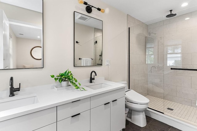 full bath featuring a shower stall, toilet, double vanity, tile patterned floors, and baseboard heating