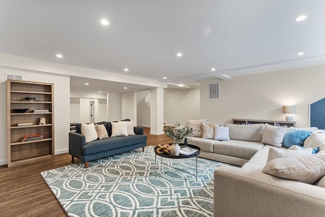 living area with stairway, wood finished floors, recessed lighting, and baseboards