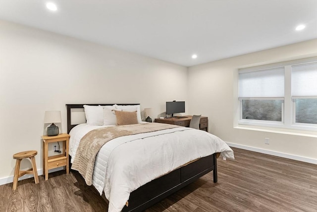 bedroom with wood finished floors, baseboards, and recessed lighting
