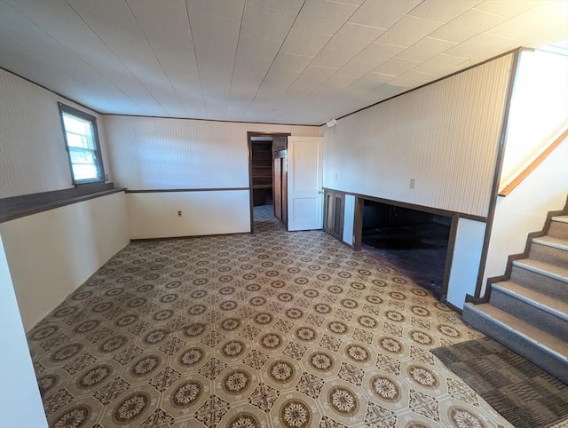 unfurnished living room with stairway