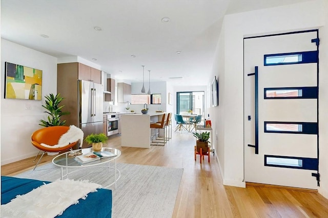 133 Charles St Unit 133, Cambridge, MA 02141 - living room with light wood-style flooring and baseboards