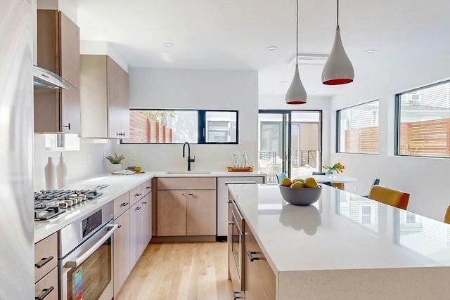 133 Charles St Unit 133, Cambridge, MA 02141 - kitchen with appliances with stainless steel finishes, a sink, plenty of natural light, light wood-type flooring, and recessed lighting