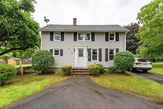 267 Maple St, East Longmeadow, MA 01028 - colonial home featuring a chimney and a front lawn