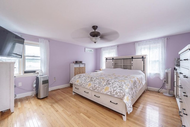 267 Maple St, East Longmeadow, MA 01028 - bedroom with light wood-style floors, multiple windows, and a ceiling fan