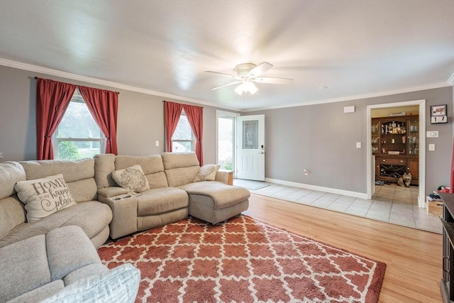 267 Maple St, East Longmeadow, MA 01028 - living room with crown molding, ceiling fan, and light wood-style floors