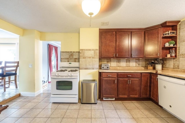 267 Maple St, East Longmeadow, MA 01028 - kitchen with white appliances, open shelves, decorative backsplash, and light countertops