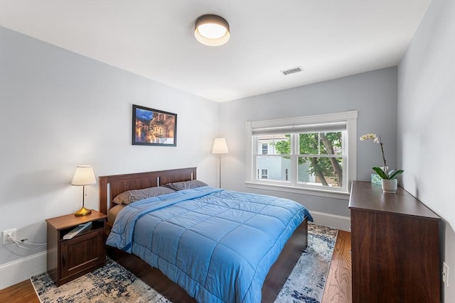 202 Middlesex Ave Unit 2, Medford, MA 02155 - bedroom featuring baseboards and wood finished floors