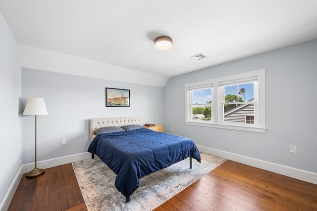 202 Middlesex Ave Unit 2, Medford, MA 02155 - bedroom with baseboards, wood finished floors, and lofted ceiling