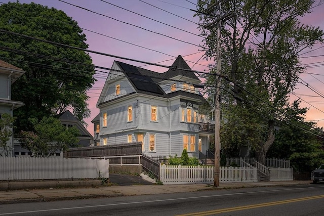 202 Middlesex Ave Unit 2, Medford, MA 02155 - victorian home featuring a fenced front yard and roof mounted solar panels