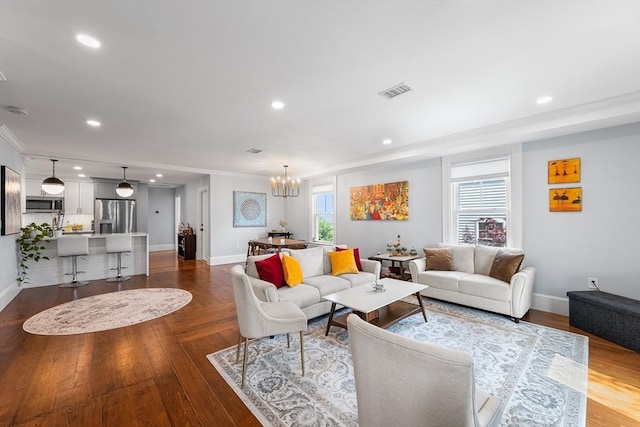 202 Middlesex Ave Unit 2, Medford, MA 02155 - living room featuring baseboards, crown molding, recessed lighting, a chandelier, and dark wood finished floors