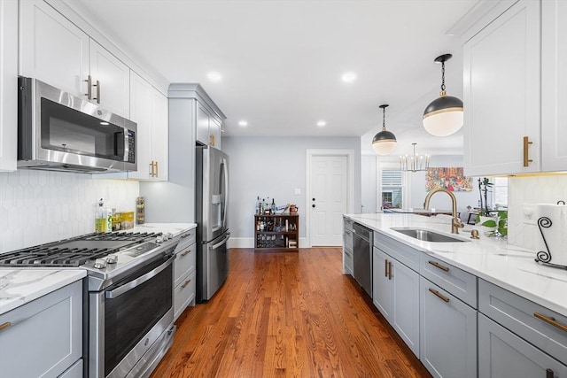 202 Middlesex Ave Unit 2, Medford, MA 02155 - kitchen with appliances with stainless steel finishes, a sink, gray cabinets, backsplash, and recessed lighting