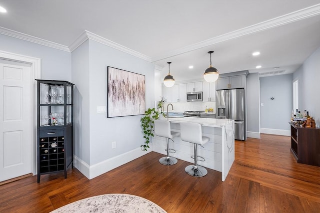 202 Middlesex Ave Unit 2, Medford, MA 02155 - kitchen featuring stainless steel appliances, a sink, baseboards, recessed lighting, and dark wood-style flooring