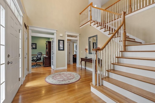 51 Drumlin Hill Rd, Bolton, MA 01740 - foyer entrance with wood finished floors, stairs, baseboards, and a towering ceiling