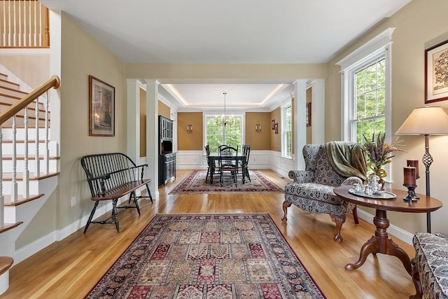 51 Drumlin Hill Rd, Bolton, MA 01740 - sitting room with light wood-type flooring, plenty of natural light, stairway, a wainscoted wall, and ornamental molding