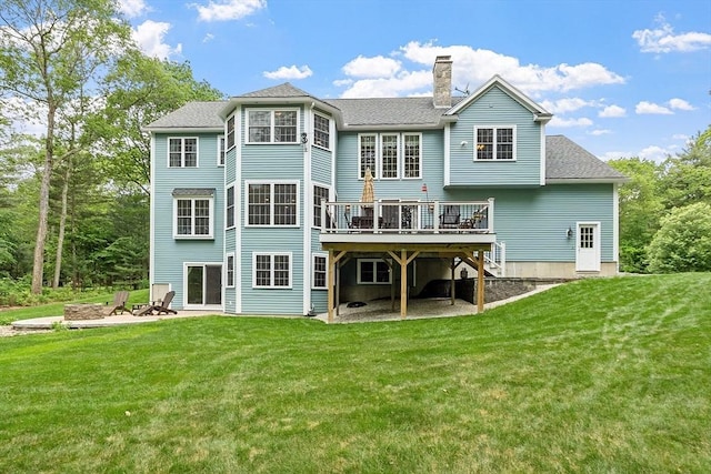 51 Drumlin Hill Rd, Bolton, MA 01740 - back of property with a wooden deck, a lawn, a chimney, and an outdoor fire pit
