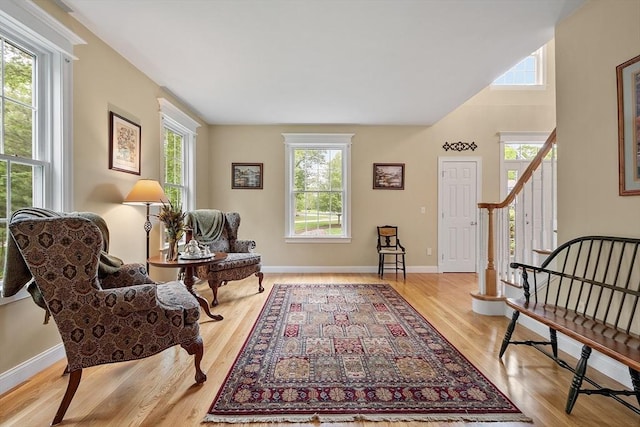 51 Drumlin Hill Rd, Bolton, MA 01740 - living area with plenty of natural light, stairs, wood finished floors, and baseboards