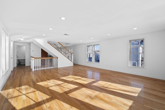 unfurnished living room with hardwood / wood-style flooring