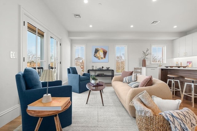 60 Williams St Unit 402, Boston, MA 02130 - living room featuring healthy amount of natural light, recessed lighting, and light wood finished floors