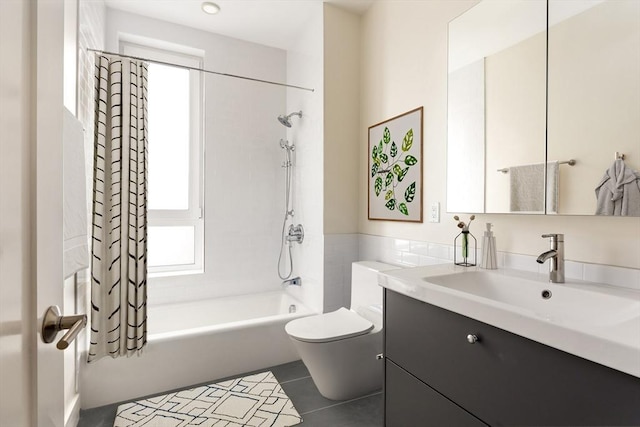 full bathroom with vanity, shower / bathtub combination with curtain, tile patterned floors, and toilet