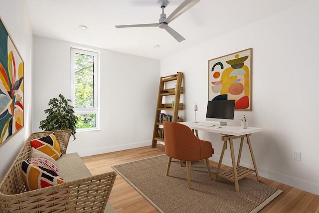 office space with wood-type flooring and ceiling fan