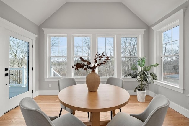 sunroom featuring lofted ceiling