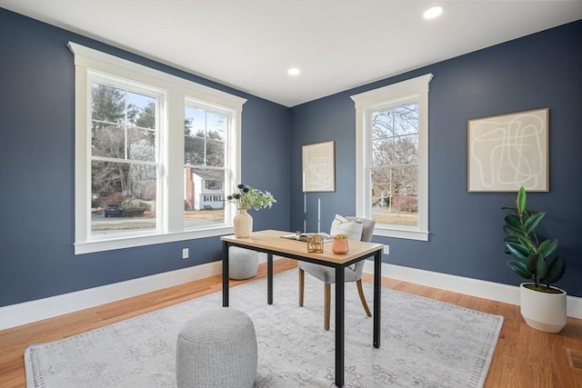 office with hardwood / wood-style floors and a wealth of natural light