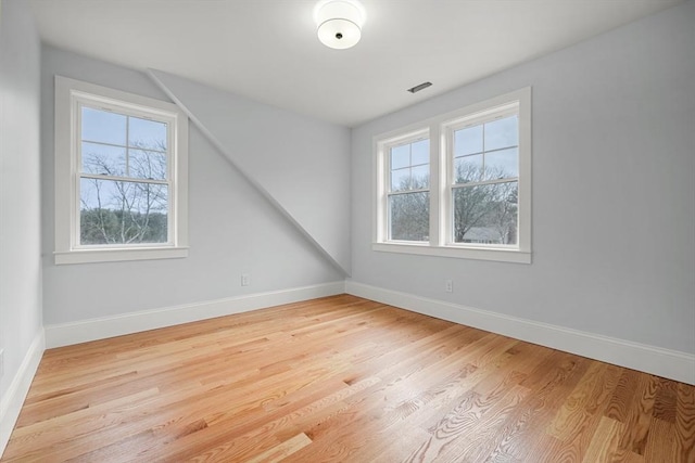 bonus room with light hardwood / wood-style floors