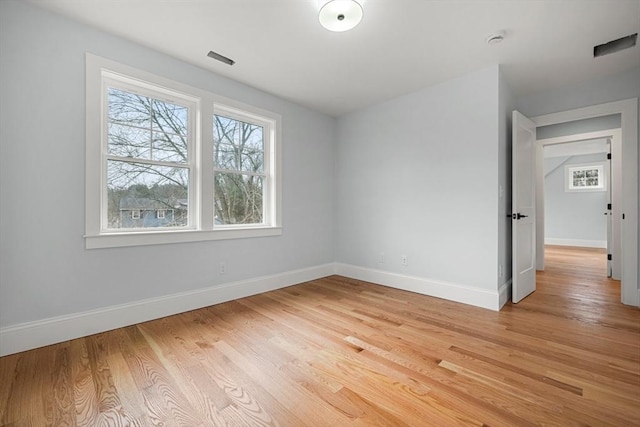 spare room featuring light hardwood / wood-style flooring