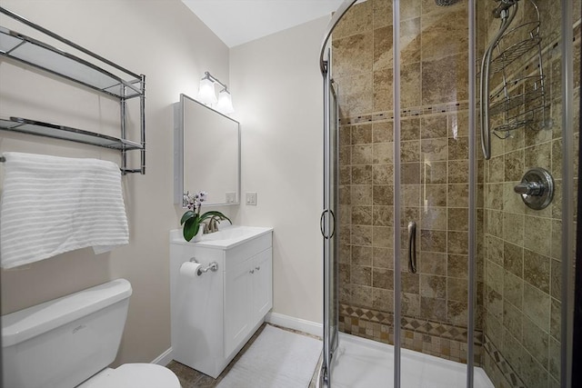 25 Day St, Newton, MA 02466 - full bathroom featuring toilet, baseboards, vanity, and a shower stall
