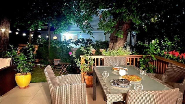 25 Day St, Newton, MA 02466 - balcony at twilight featuring outdoor dining space and a patio area