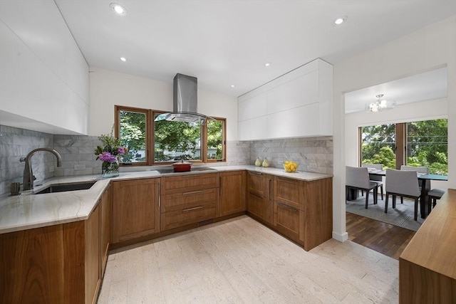 25 Day St, Newton, MA 02466 - kitchen featuring island range hood, a sink, brown cabinetry, tasteful backsplash, and recessed lighting