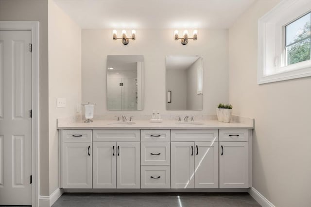 62 High St Lot 6, Stoneham, MA 02180 - bathroom with double vanity, a stall shower, and baseboards