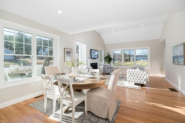 62 High St Lot 6, Stoneham, MA 02180 - dining area featuring vaulted ceiling, a fireplace, baseboards, light wood-type flooring, and recessed lighting