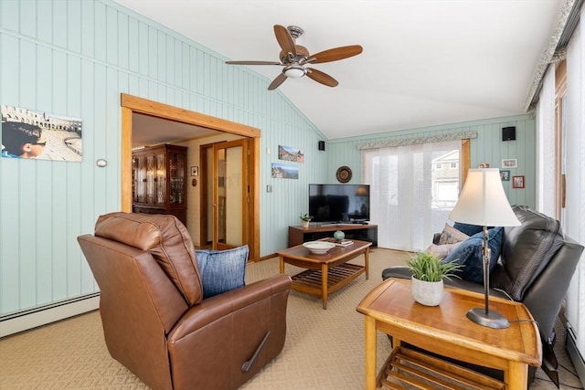 living room with a healthy amount of sunlight, lofted ceiling, light carpet, and a baseboard heating unit