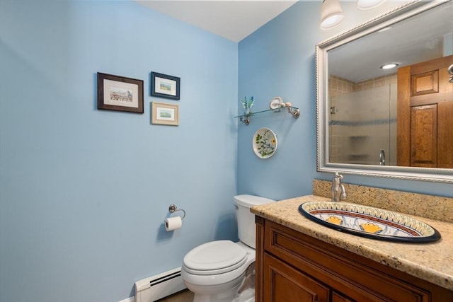 bathroom with an enclosed shower, vanity, a baseboard radiator, and toilet