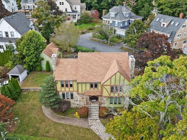 birds eye view of property with a residential view