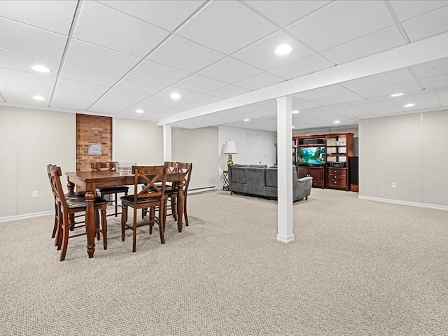 dining area with carpet, a paneled ceiling, baseboards, and recessed lighting