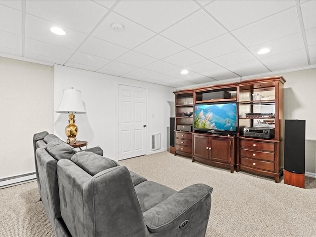 carpeted living area featuring recessed lighting, visible vents, a drop ceiling, and baseboard heating