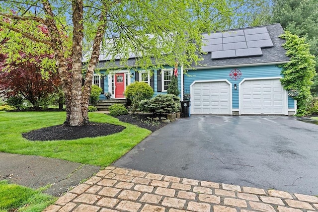 16 Old Colony Way, Whitman, MA 02382 - view of front of home with driveway, a garage, solar panels, a shingled roof, and a front yard