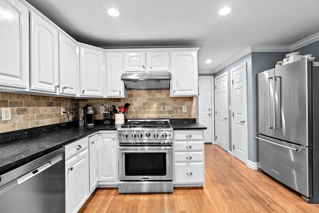 16 Old Colony Way, Whitman, MA 02382 - kitchen with high end appliances, under cabinet range hood, ornamental molding, white cabinetry, and dark countertops