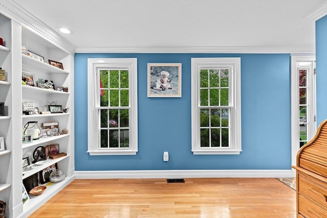 16 Old Colony Way, Whitman, MA 02382 - entryway with wood finished floors, baseboards, and ornamental molding