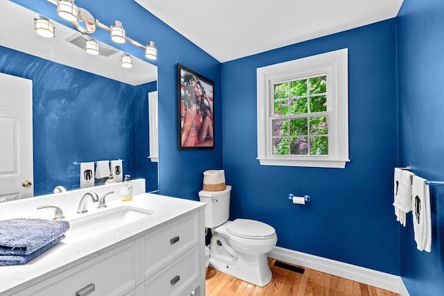 16 Old Colony Way, Whitman, MA 02382 - bathroom featuring baseboards, toilet, wood finished floors, and vanity