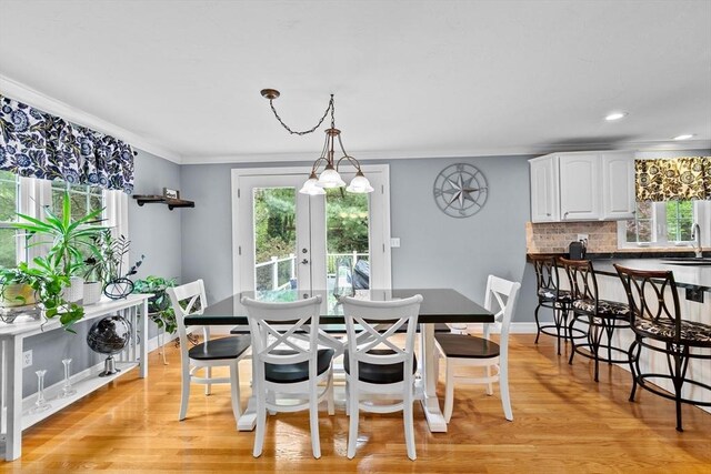 16 Old Colony Way, Whitman, MA 02382 - dining space with healthy amount of natural light, crown molding, light wood-style floors, baseboards, and recessed lighting