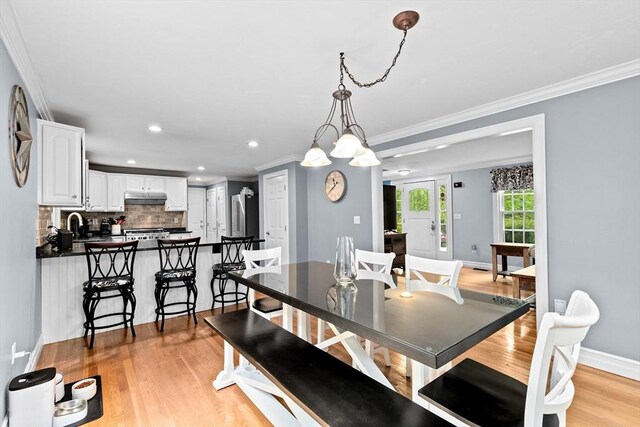 16 Old Colony Way, Whitman, MA 02382 - dining room featuring light wood-type flooring, crown molding, baseboards, and recessed lighting