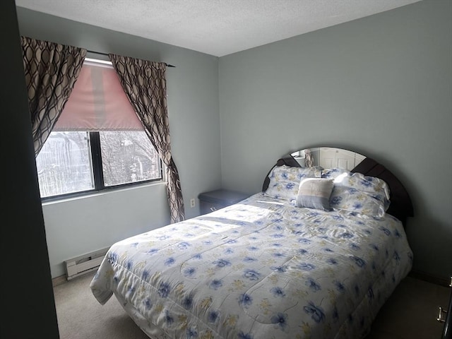 bedroom featuring a baseboard radiator, carpet flooring, and a textured ceiling